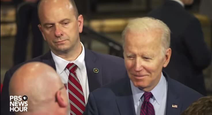 So What Pin is that Shadow Man Wearing Behind the Fake Biden?