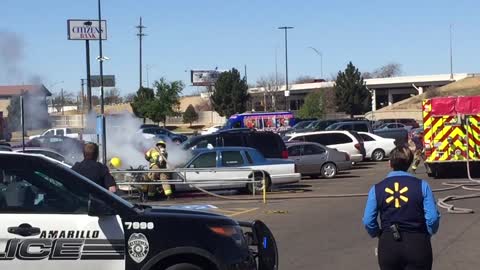 Burning Car in Parking Lot