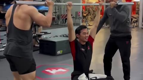 Trio Of Weightlifters Playing With Physics