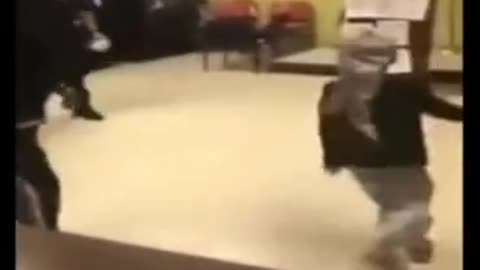 A child dancing with the American police