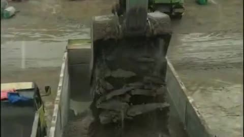 dump truck queue at sand mining