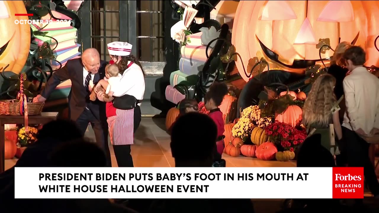 At the White House Halloween event, Biden literally put a baby’s foot in his mouth! 🤬