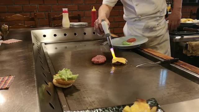 Japanese chef making burgers like a pro