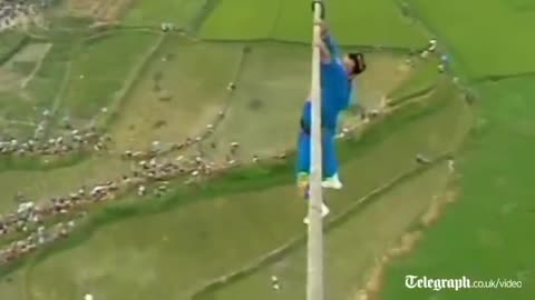 Acrobat falls off tight-rope in death defying high wire stunt gone wrong