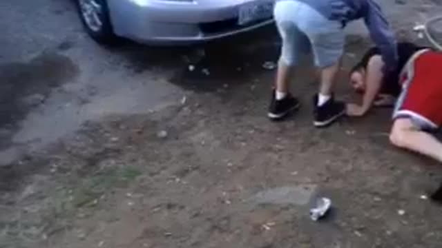 Nsfw guy in red shorts falls on dirt in front of a house