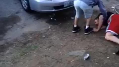 Nsfw guy in red shorts falls on dirt in front of a house