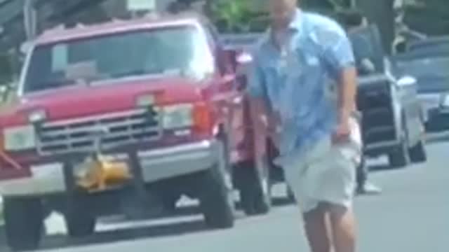 Blue shirt visor skating down street