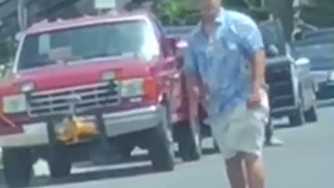 Blue shirt visor skating down street