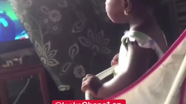 Hilarious as a 3 year African girls frowns at mum and then watches television