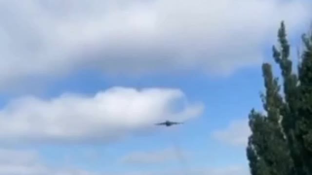 Russian Su-25SM attack aircraft pass over a convoy of the Russian Armed Forces