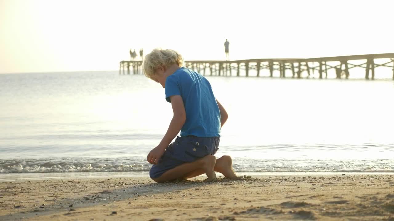 Young boy playing at the beach