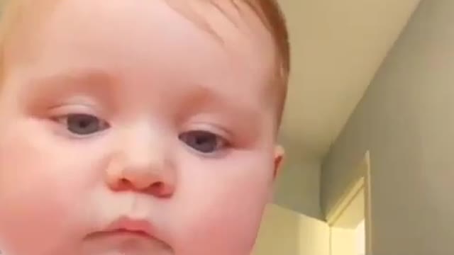 Funny baby boy eating moms smart phone haha