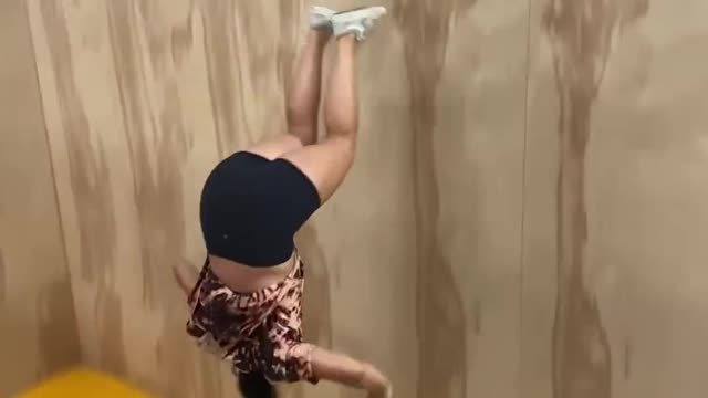 Girl Falls to The Ground Trying a Pull Over a Trampwall