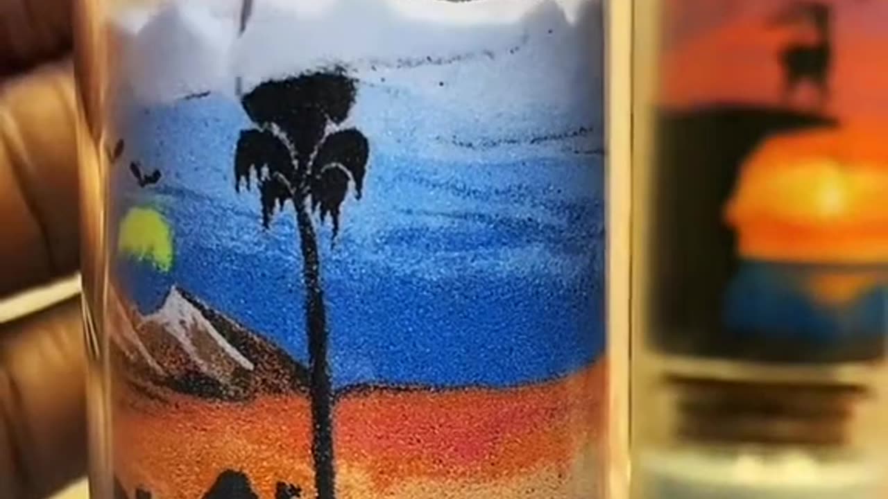 Creative sand painting in a cup, painting the sunset and the beautiful picture of the evening