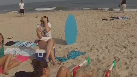 Collab copyright protection - beach woman handstand bars faceplant