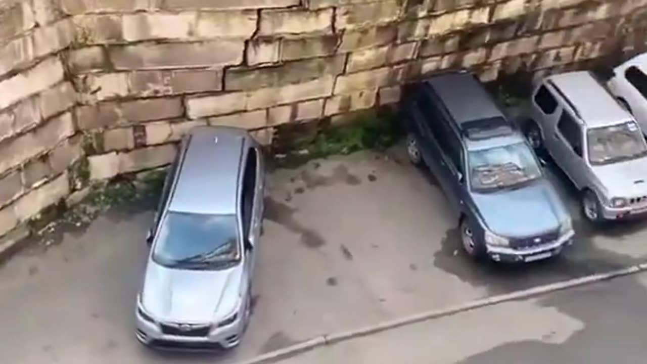 Vladivostok, Russia. Driver who noticed that a wall was just about to collapse, saved her car.....