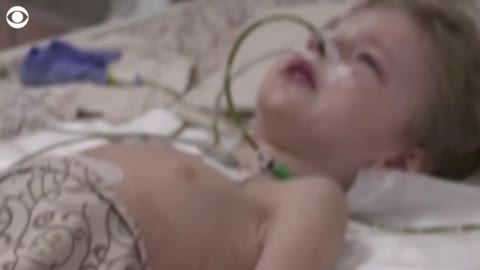 Ukrainian boy cries for his dad from hospital bed after family injured in Mariup