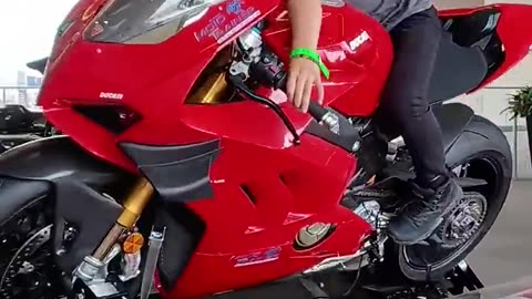 Young kid on a Panigale_ playing Ride4. Motorbike simulator_