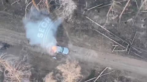 Russian drone drop grenade onto a Ukrainian ammo pickup truck in Serebryanskoye forestry