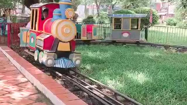 Cute baby playing roller coaster