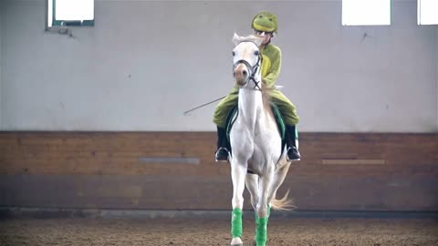 Girl in Frog Costume Riding White Horse Slow Motion