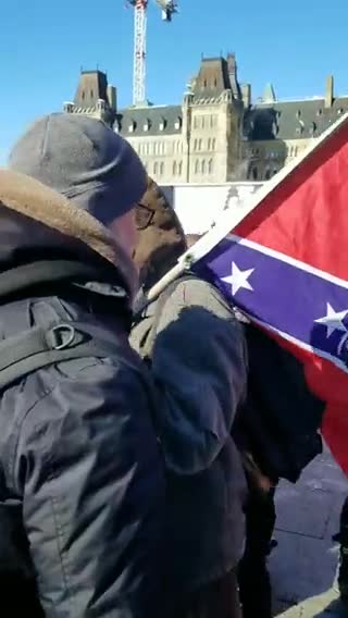 Crowd booing confederate flag in Ottawa