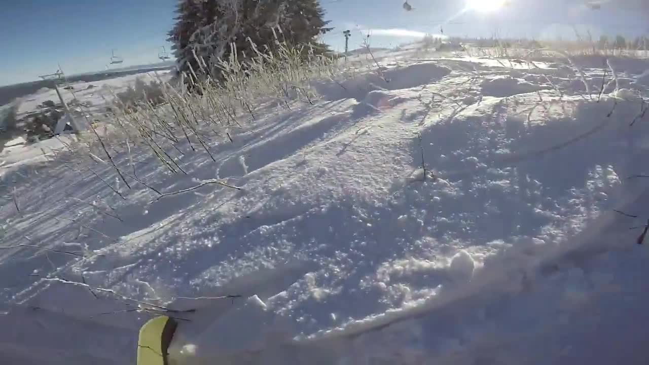 Yellow pants snowboard faceplant