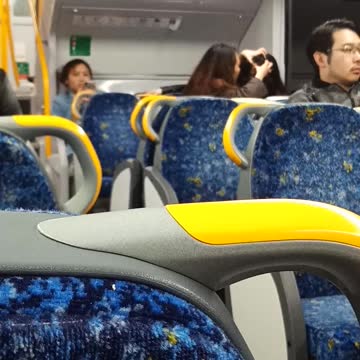 Woman popping friends forehead pimple subway train