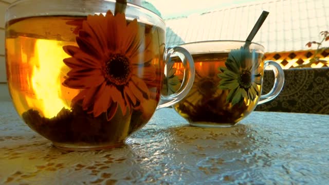 Tea leaves dancing in the cup