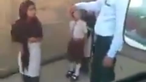 A male teacher assaults little girls who are not wearing a hijab.