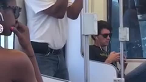 Man white t shirt dancing by train door