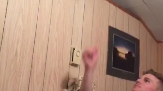 Girl in jean jacket jumps over and lands on bed