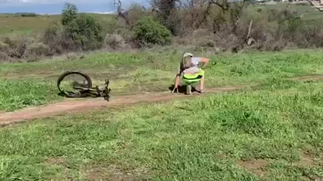 Biker does a jump off ramp and lands on his face