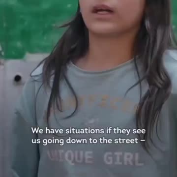 Palestinian homes and marketplaces throw trash down at the Palestinians below