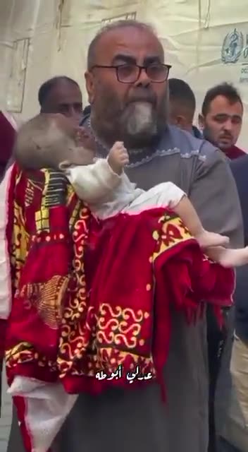 A Palestinian who lost 16 of his family members, including this little baby