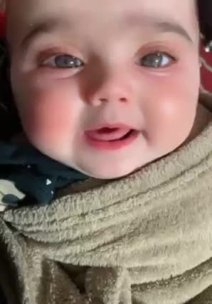 Cute baby talking to her mom