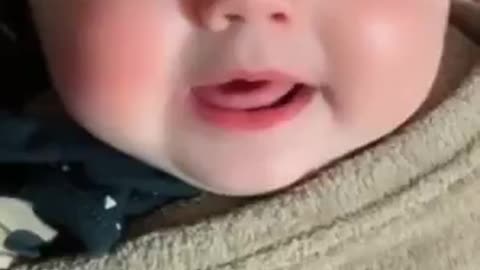 Cute baby talking to her mom