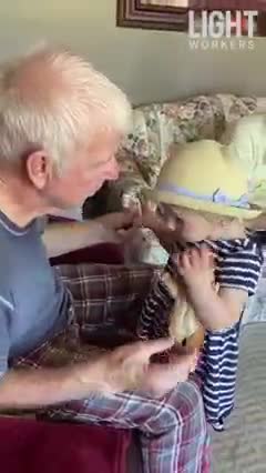 Grandpa With Parkinsons Kisses Grand Daughter Sweetly