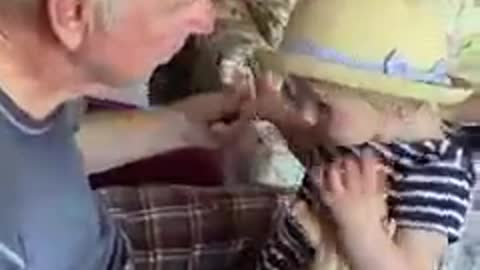 Grandpa With Parkinsons Kisses Grand Daughter Sweetly