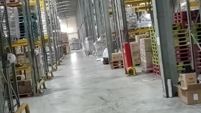 Reverse with a forklift in a warehouse