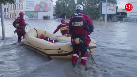 Rescuers help residents of Opava, Czech Republic stranded by floods