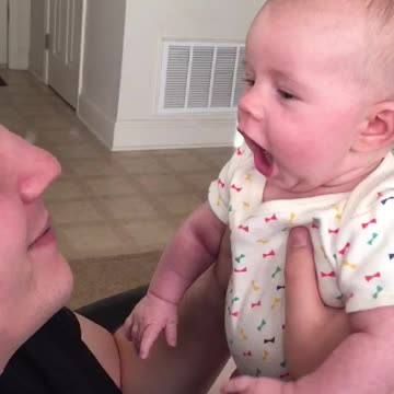 Baby girl loves on her daddy