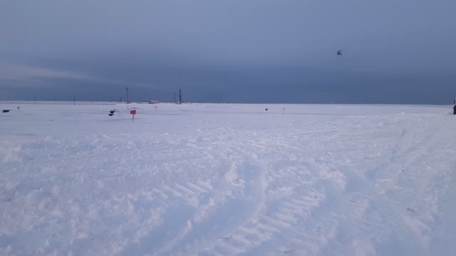 helicopter landing in the tundra