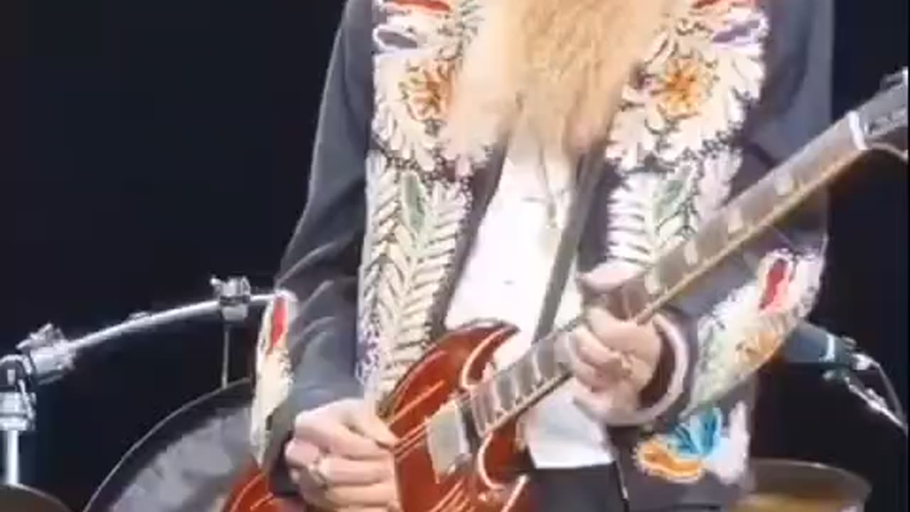 Nothing unusual just the bassist of ZZ Top performing on a 17-string bass guitar