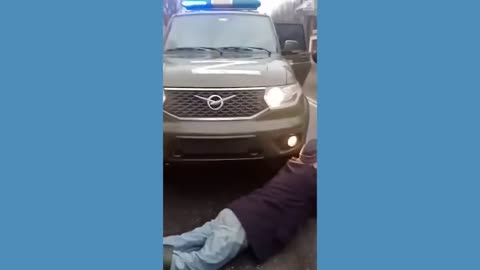 Protesting civilians confront Russian military vehicles in Ukraine