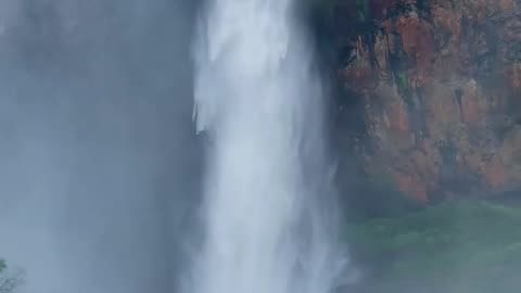 Peace in the heart of nature: the stunning beauty of a waterfall