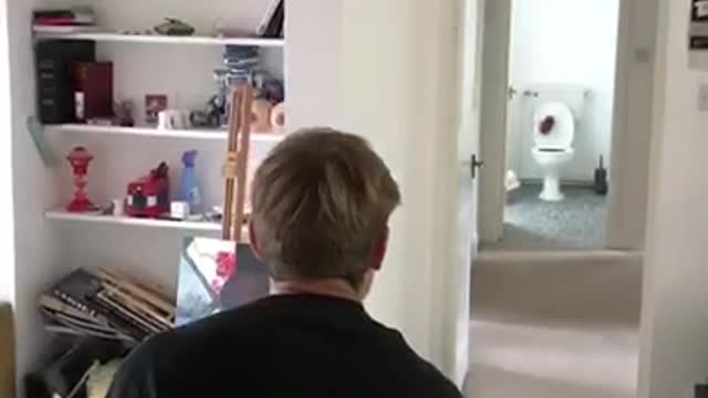 Black shirt throws football into toilet