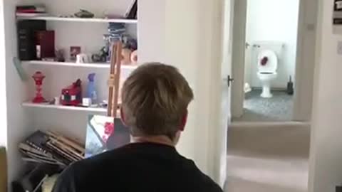 Black shirt throws football into toilet