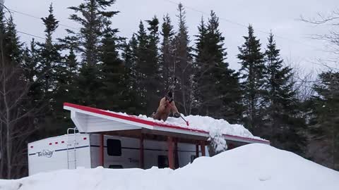 Slippery Roof Leads to Snow-Cushioned Fall