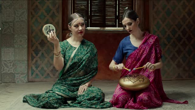 Hindu stylish women playing music